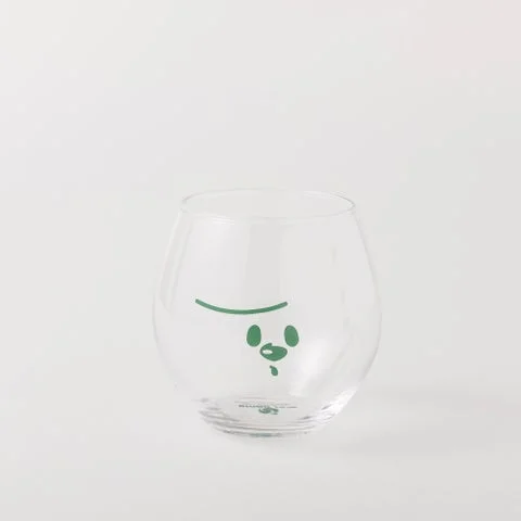 メメルの顔が描かれた透明なコロン型グラス