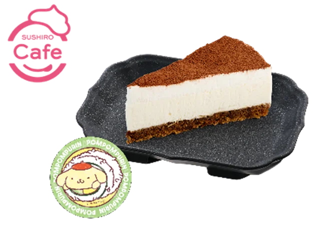 黒い皿に盛られたティラミスケーキとポムポムプリンのステッカー
