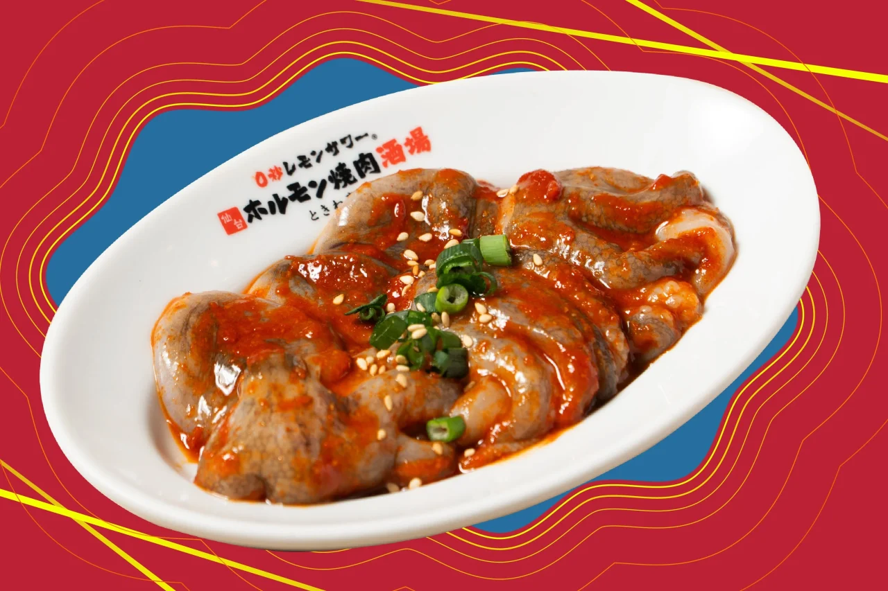 焼きチュクミ。イイダコに辛味だれを絡め、ネギとごまを添えた一皿