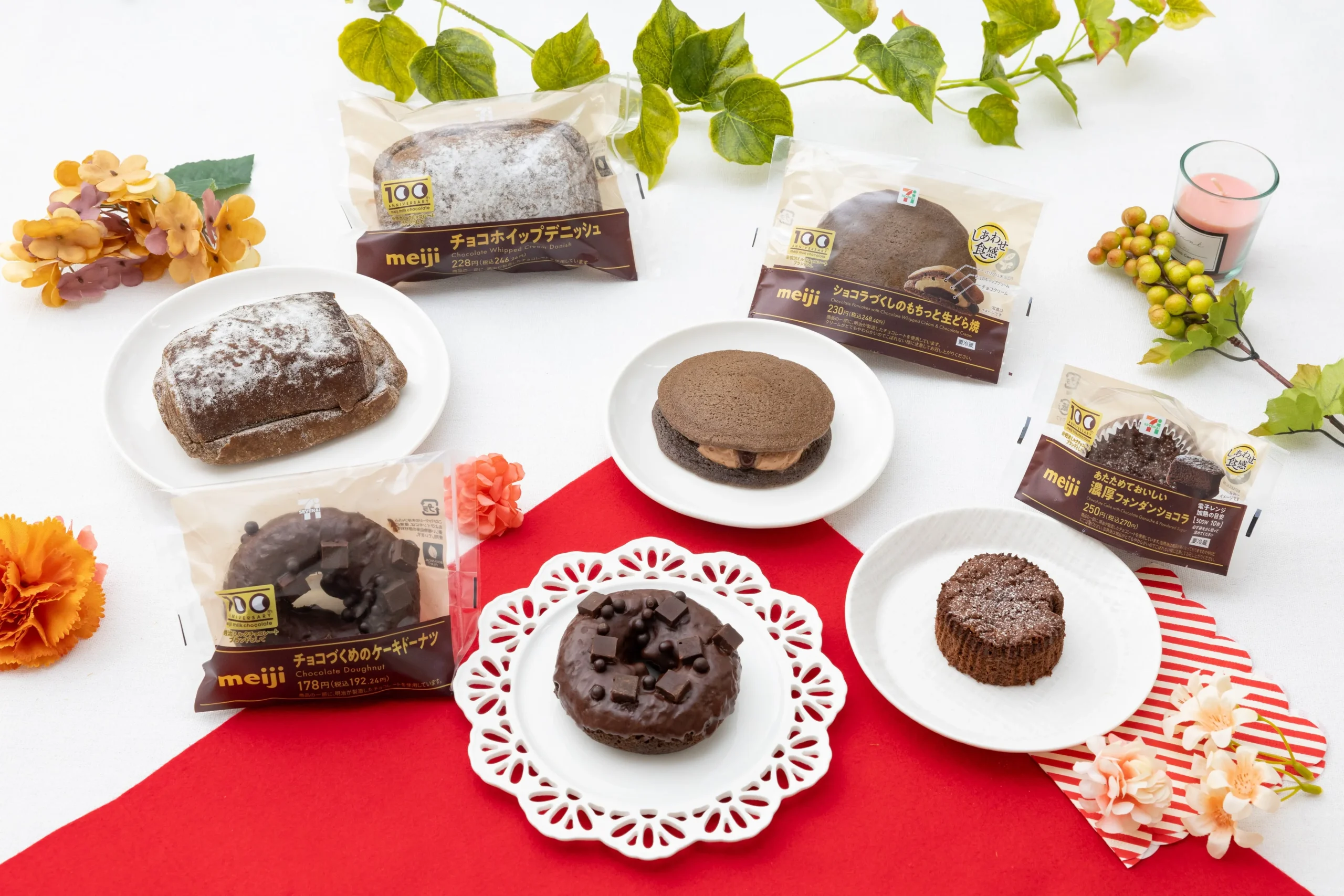 明治ミルクチョコレート100周年記念コラボスイーツ・パン全4品のパッケージと実物を並べた集合写真