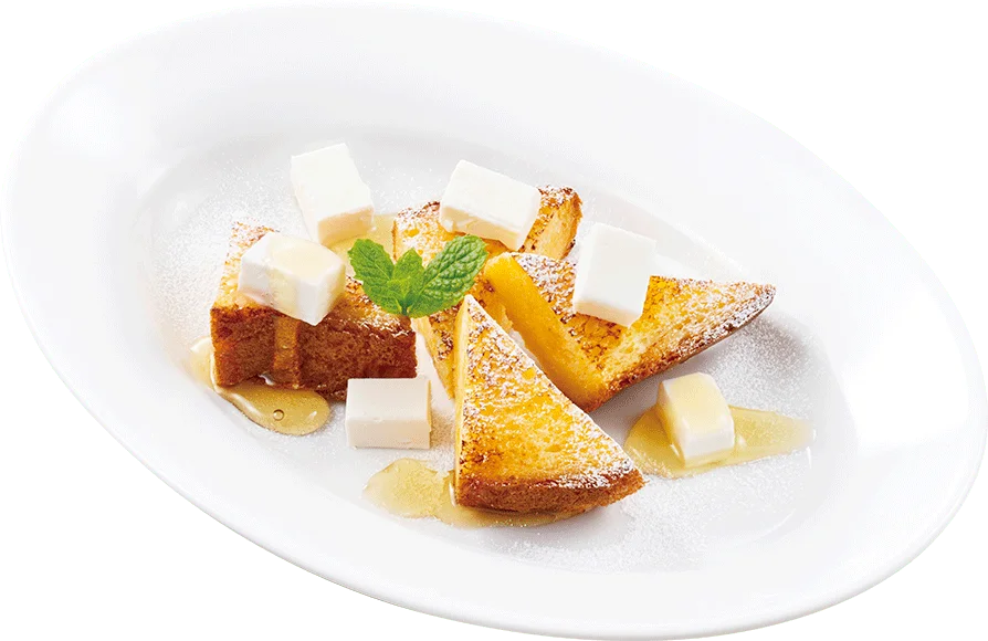 白い楕円皿に盛られたイタリアンフレンチトースト。クリームチーズとはちみつ、ミント添え