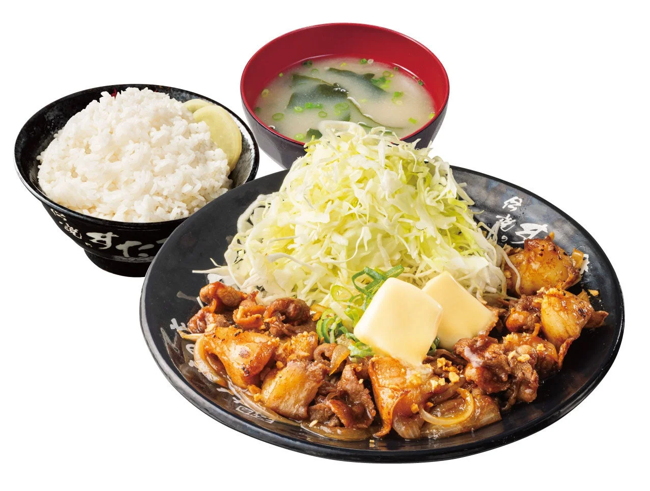 『定食』。ご飯、味噌汁、キャベツとバター2切れをのせた肉の皿