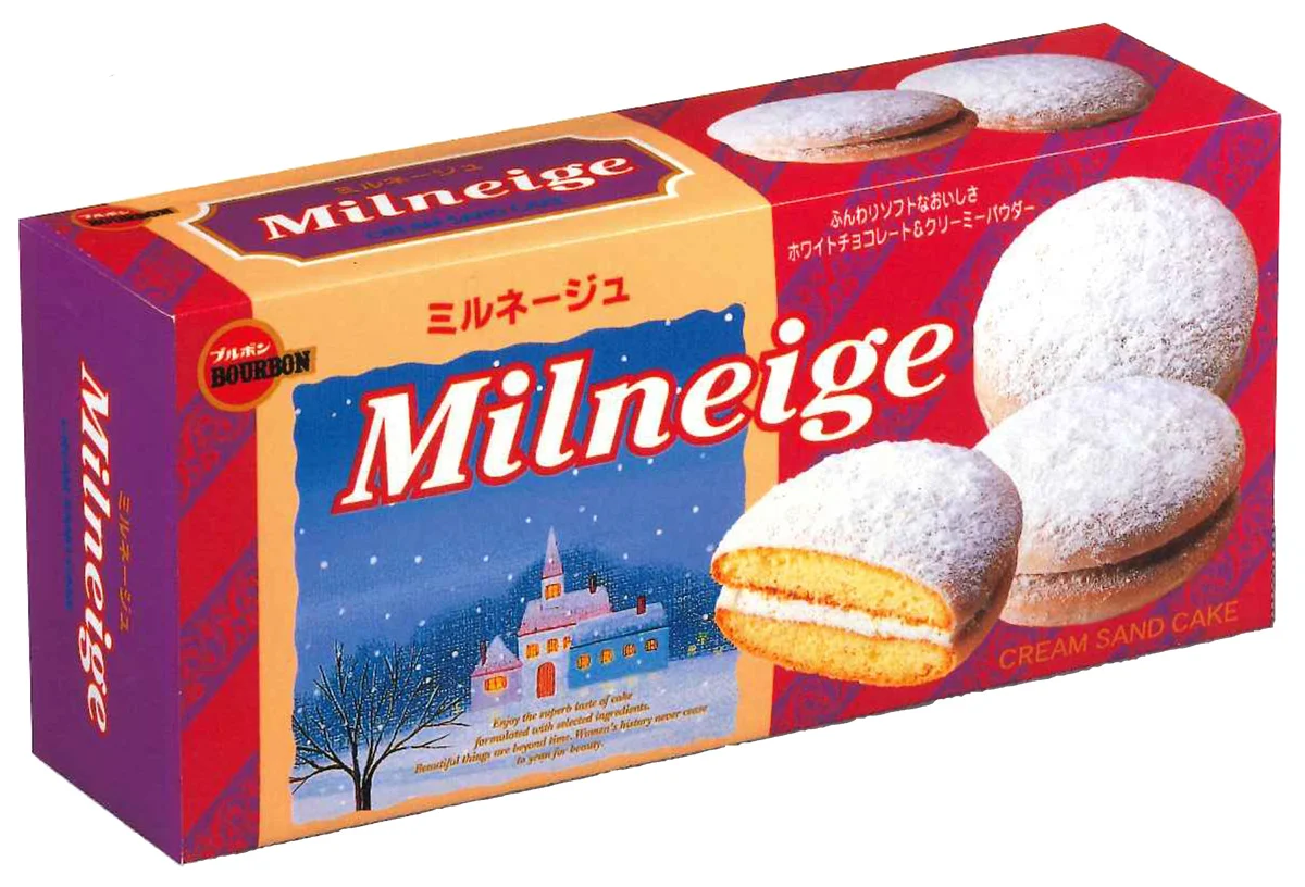 1997年発売当初の箱入りミルネージュのパッケージと粉雪をかけた丸いケーキ
