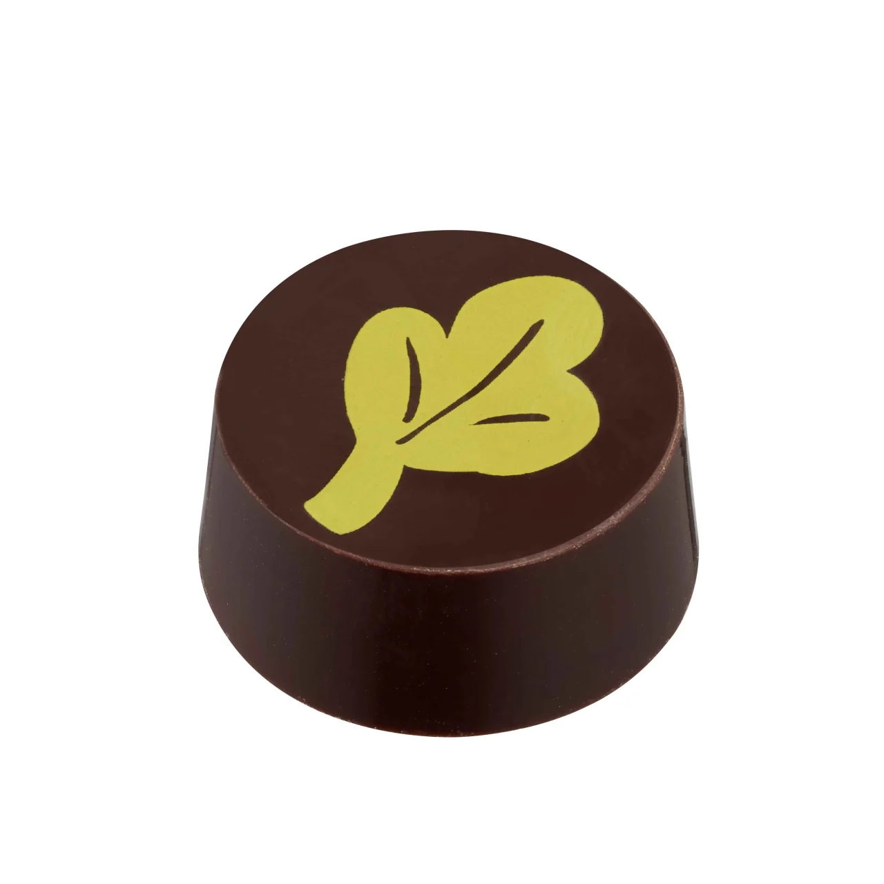 抹茶ガナッシュ。葉のような黄緑の模様が入った丸いダークチョコレート