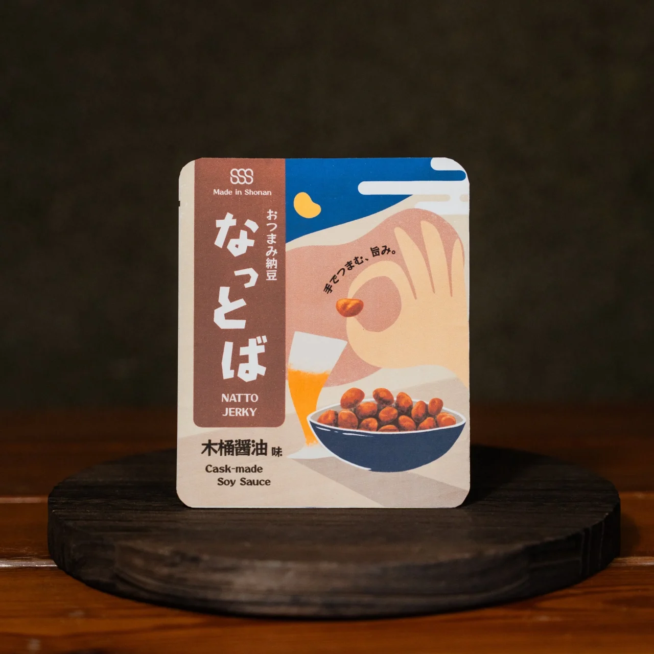 おつまみ納豆「なっとば」木桶醤油味のパッケージ。納豆の入った器のイラスト