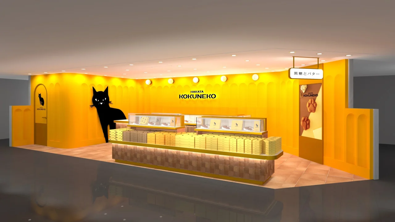 黄色い内装に黒猫のイラストがある、HAKATA KOKUNEKOの店舗イメージ