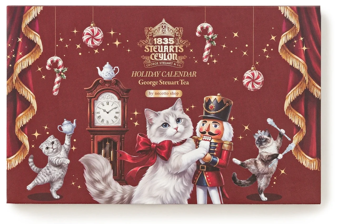 バーガンディーの表紙に、くるみ割り人形と踊る猫たちを描いた紅茶のカレンダー
