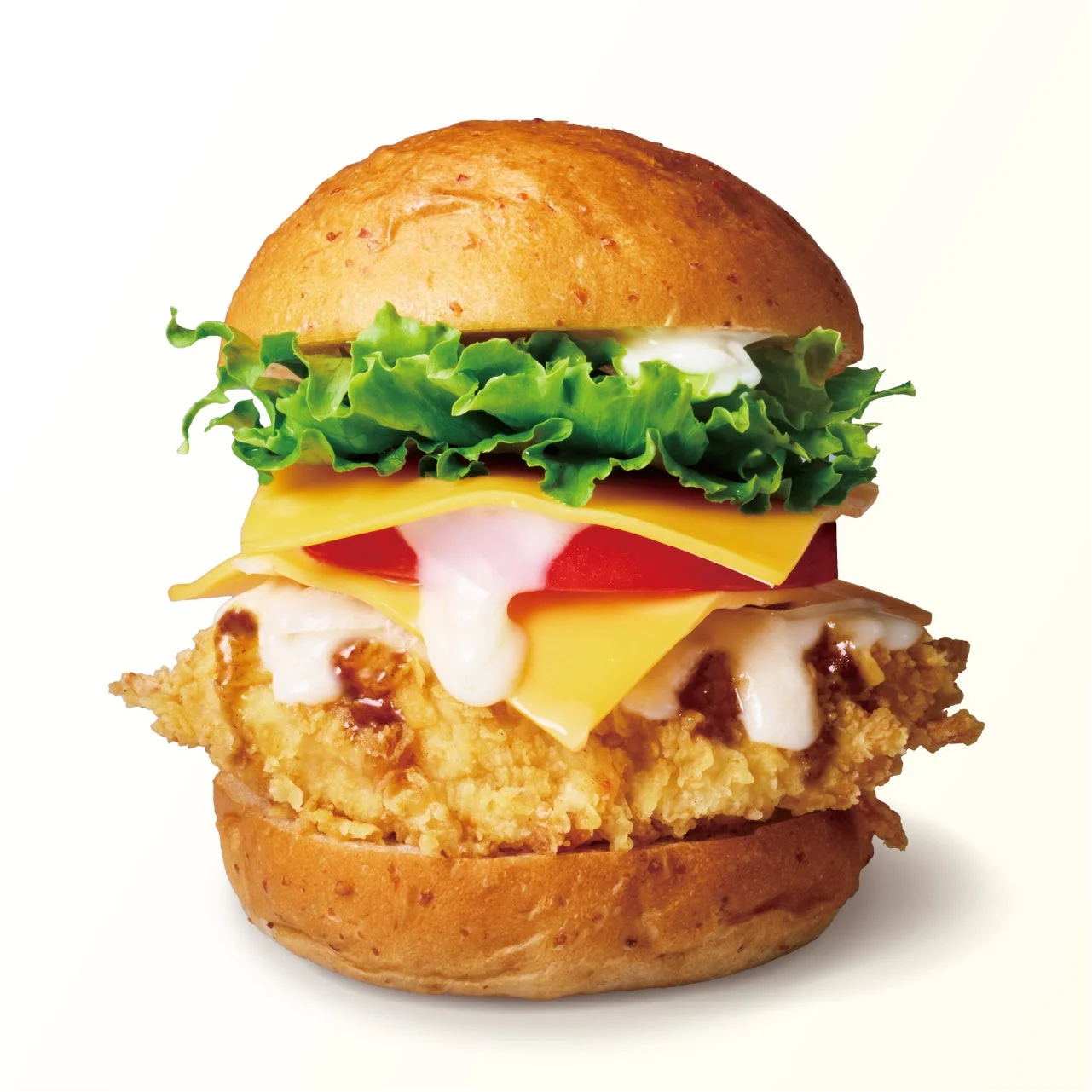 ポルチーニ香るダブルチーズバーガー。レタスとチーズ、トマト、ソースが重なる